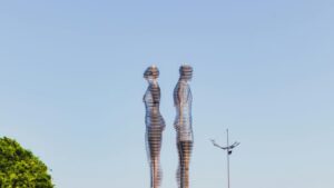 Captivating Ali and Nino metal sculpture against a clear blue sky in Batumi, Georgia's urban landscape.